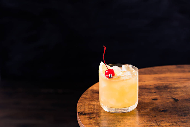 Refreshing Whiskey Sour Cocktail on a Table - Valokuva, kuva