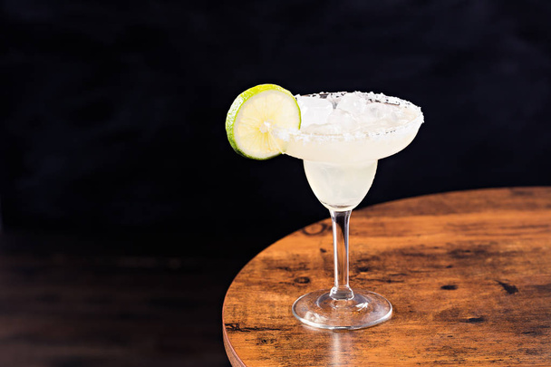 Refreshing Tequila Margarita Cocktail on a Table - 写真・画像