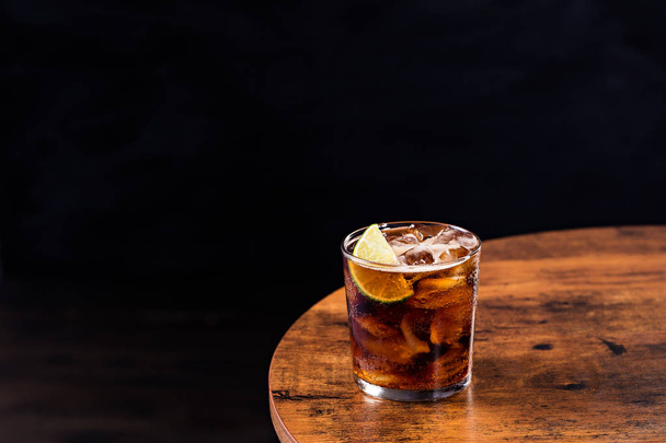 Refreshing Rum and Cola Cocktail on a Table - Fotografie, Obrázek