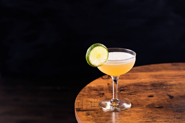 Refreshing Vodka Gimlet Cocktail on a Table - 写真・画像