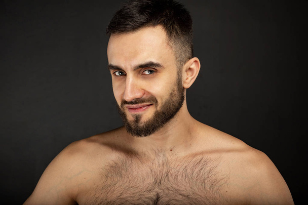 A portrait of a handsome naked man with beard - Foto, Imagem