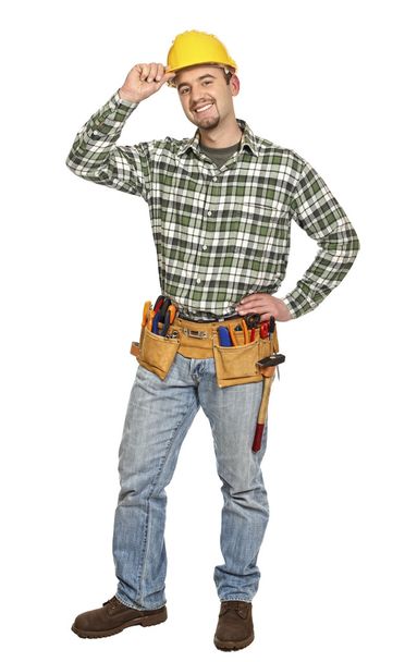 Standing young handyman - Foto, Bild