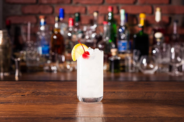 Refreshing Tom Collins Cocktail on a Bar - Fotó, kép