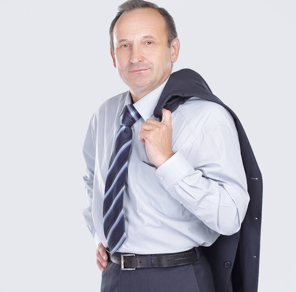 confident businessman holding a jacket over his shoulder - Fotó, kép