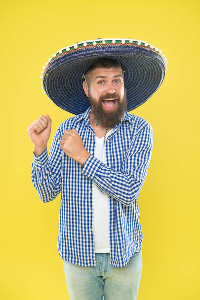 Mexican culture concept. Celebrate mexican holiday. Mexican bearded guy ready to celebrate. Customs and traditions. Sombrero wide brimmed hat provides plenty of shade. Man wear sombrero mexican hat - Photo, image
