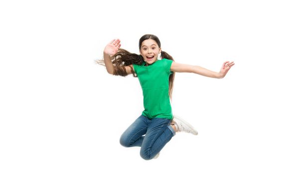 Leisure and activity. Active game for children. Kid captured in motion. How raise active kid. Free and full of energy. Rules to keep kids active. Girl cute child with long hair feeling awesome active - Valokuva, kuva