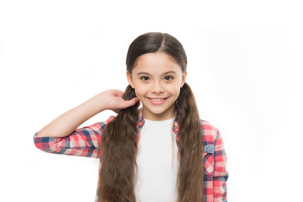 Giving hair a silky perfection. Pretty girl with long hairstyle. Little girl with stylish ponytail hairstyle. Little child with brunette hair. Small hair model with beauty look. Hair salon for kids - 写真・画像