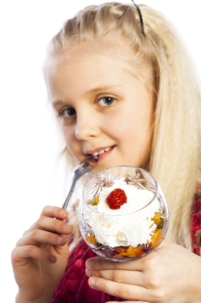 Beautiful blonde girl eating dessert - Фото, зображення