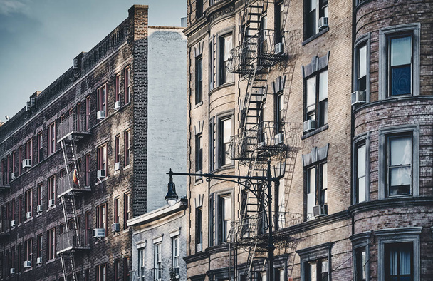 New York old buildings with fire escapes, color toned picture, USA. - Foto, Imagem