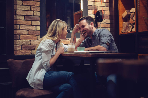Beautiful couple on a romantic date in cafe  - Fotó, kép