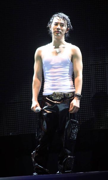 South Korean singer Jun Jin performs during his solo concert, in Shanghai, China, February 21, 2009. - Zdjęcie, obraz