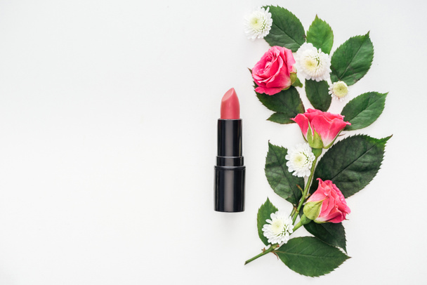 top view of flowers composition with lipstick isolated on white - Φωτογραφία, εικόνα