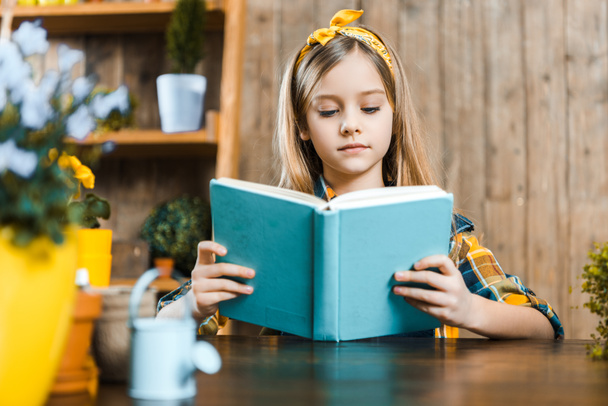 selective focus of cute kid reading book  - Φωτογραφία, εικόνα