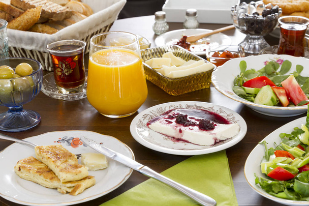 close up view of various dishes and jug of juice on table - Foto, immagini
