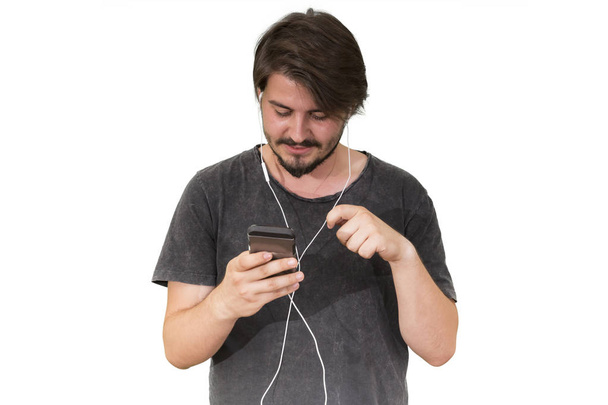 людина в навушниках зі смартфоном прослуховування музики ізольовано на білому тлі
 - Фото, зображення