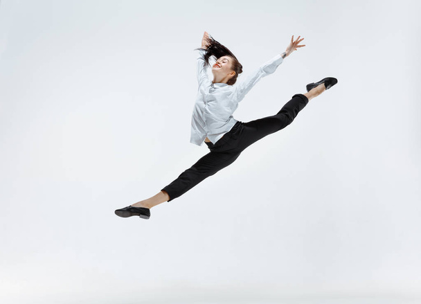 Happy business woman dancing and smiling isolated on white. - 写真・画像