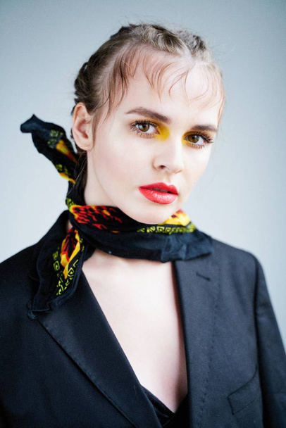  Beautiful Young Woman Posing  in jacket and neck scarf - Fotoğraf, Görsel