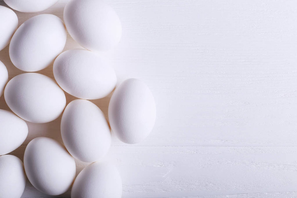 White eggs pattern, on wooden table. - Valokuva, kuva