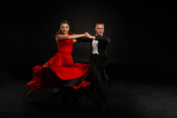 Beautiful couple in the active ballroom dance - Photo, image