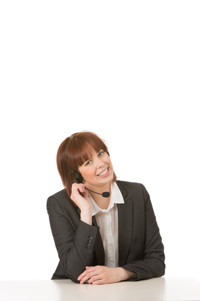 φιλικό χαμογελαστό χειριστή θηλυκό τηλεφωνικού κέντρου - Φωτογραφία, εικόνα