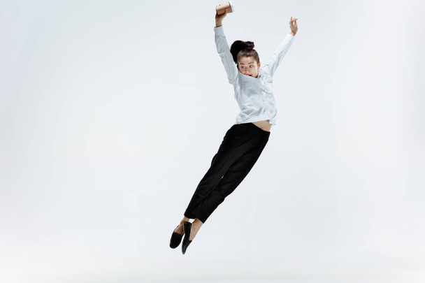 Happy business woman dancing and smiling isolated on white. - Фото, зображення