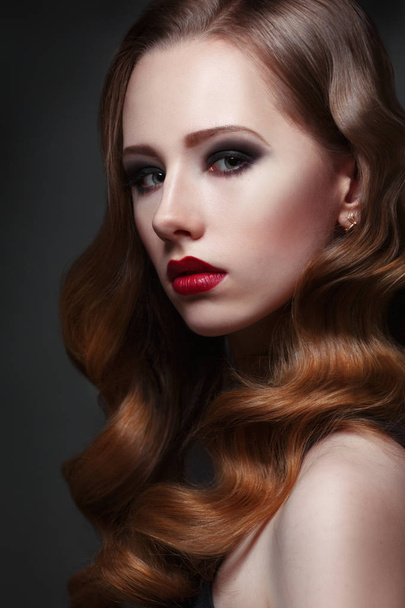 Portrait of beautiful young woman with curls and red lipstick  - Foto, immagini