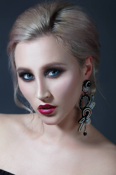 Portrait of young woman with evening makeup - Fotó, kép