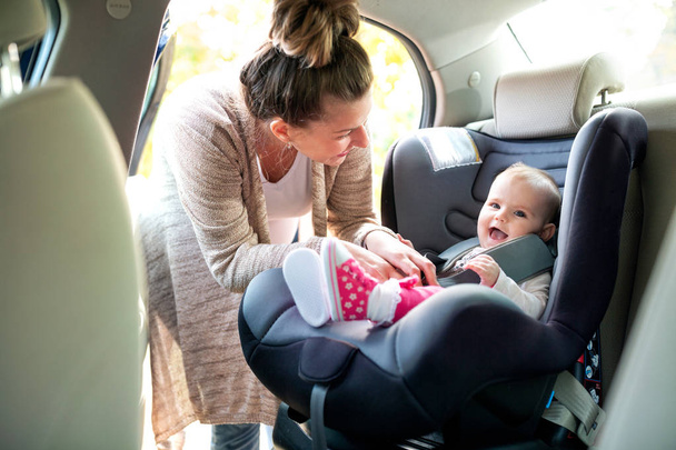 Cute baby in infant car seat perfectly designed to satisfy needs of a little child  - Foto, afbeelding