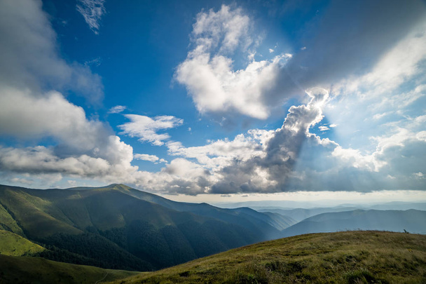 Landscape of Borzhava ridge of the Ukrainian Carpathian Mountains. Clouds above Carpathians - Φωτογραφία, εικόνα