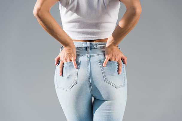 Cropped view of sexy girl in blue jeans  - Photo, Image