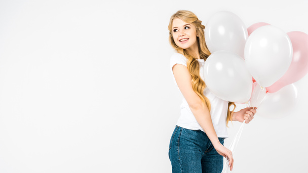 happy attractive woman holding pink and white air balloons on white background with copy space - Fotoğraf, Görsel
