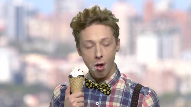 Caucasian teenage boy eating an ice cream. - Footage, Video