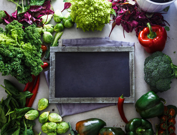 Fresh vegetables flatlay overhead frame.Blackboard with vegetables.. Food layout. Diet. Dieting plan - Photo, Image