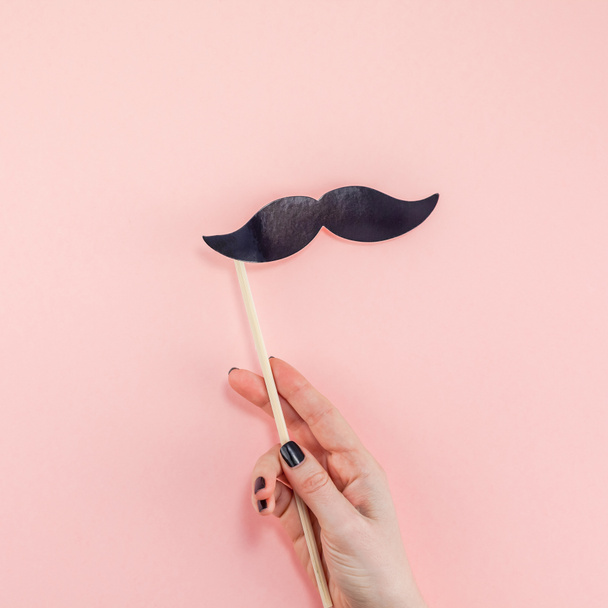 Creative flatlay overhead top view retro stylish black paper photo booth props moustaches pink background copy space. Men health awareness month fathers day masculinity concept blog social media - Photo, Image