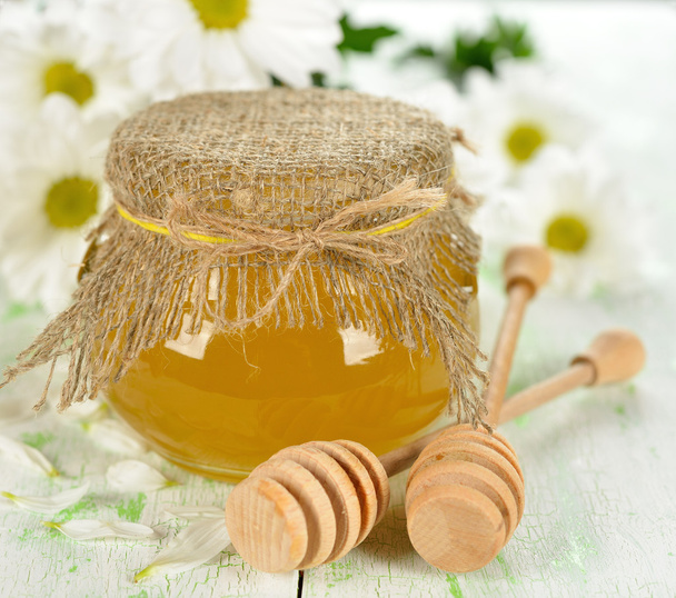 Honey and flowers on a white background - Foto, immagini
