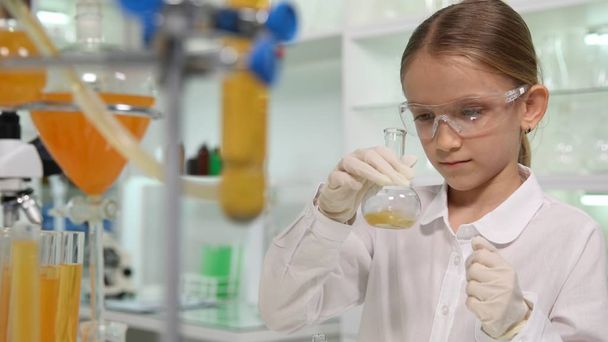 Child Studying Chemistry in School Lab, Student Girl Making Experiments - Photo, image