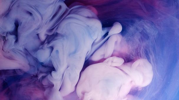 Blue pink clouds of ink in liquid. black background - Photo, Image