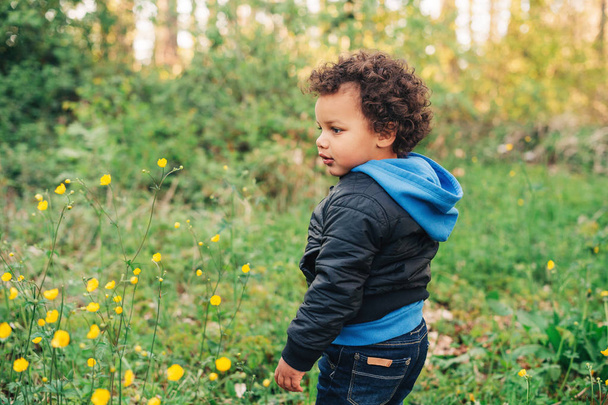 Adorable african toddler boy hiking in spring forest - Photo, Image