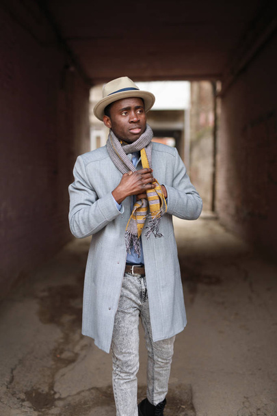 African american man portrait wearing a scarf in urban city - Photo, image