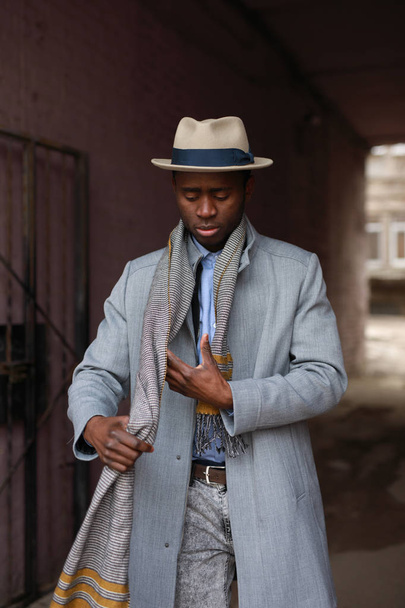 African american man portrait wearing a scarf in urban city - Foto, Imagen