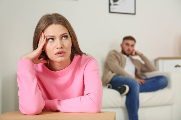 Young couple ignoring each other after argument in living room. Relationship problems - Photo, Image