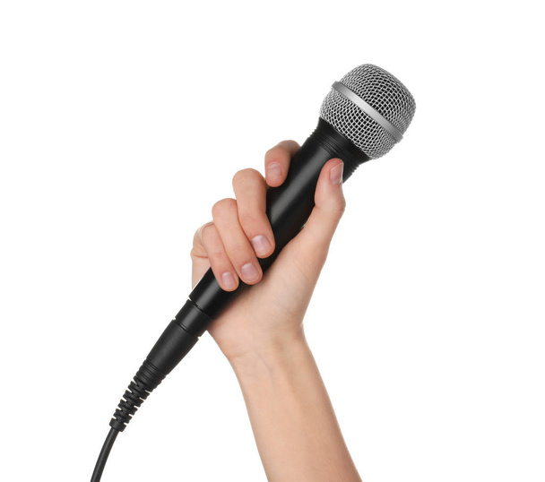 Woman holding dynamic microphone on white background, closeup - Фото, изображение