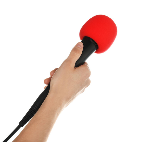 Woman holding microphone on white background, closeup - Foto, Imagen