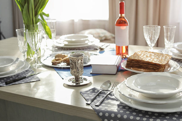 Table served for Passover (Pesach) Seder indoors - Zdjęcie, obraz