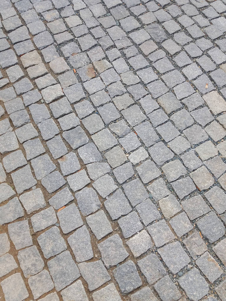 A cobblestone pavement useful as a background - Photo, Image