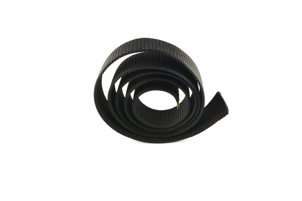 Zwart nylon taille riem bevestiging oprollen geïsoleerd op witte achtergrond - Foto, afbeelding