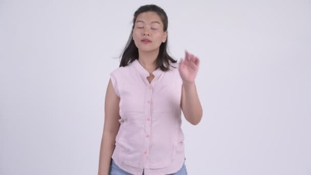 Young serious Asian businesswoman with stop gesture - Felvétel, videó
