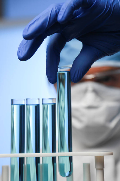 Chemist and test tubes - Фото, изображение