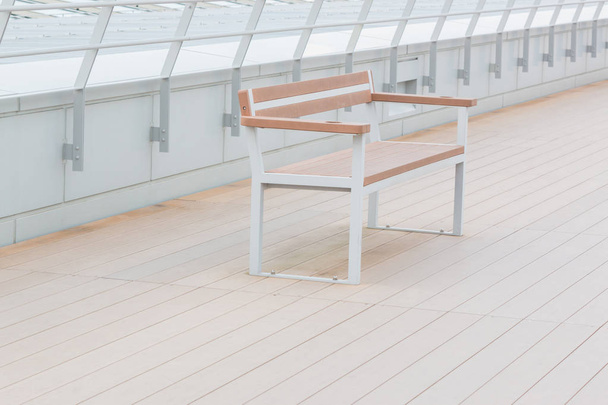 Empty wooden bench in park, concept feeling loneliness. - Фото, зображення