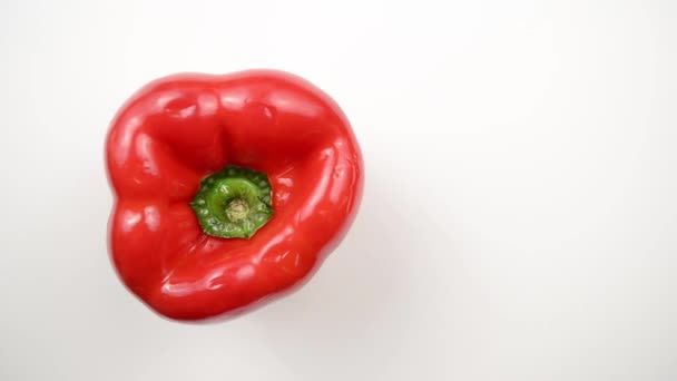 Rotating Red Pepper Against White - Overhead Dolly Left - Footage, Video